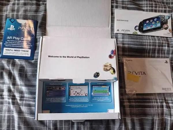 Sony PS Vita Oled handheld console with 25 games