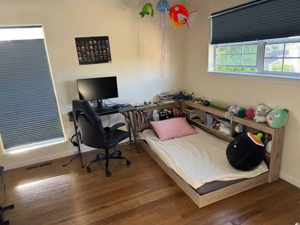 Twin bed with bookshelf and mattress