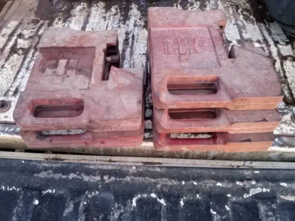 Original IH 75# stamped suitcase weights & 12-hole brackets
