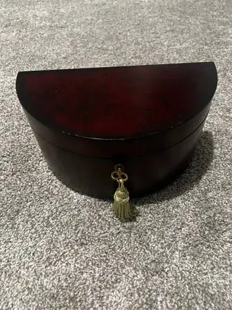Used wood jewelry case with key