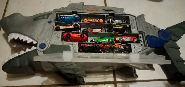 Car carrier with 22 cars and other cars