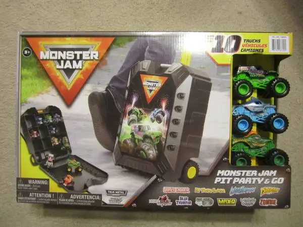 New in Box Monster Jam Pit Party & Go 10 Trucks with Carrying Case