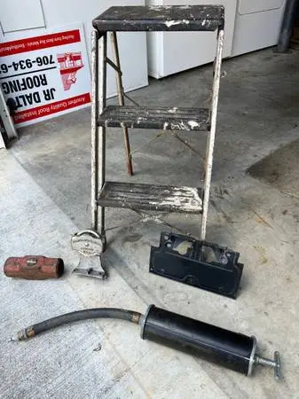 Step Stool, Grease Pump, Flip-Up License Plate, Sledge Head, Pulley