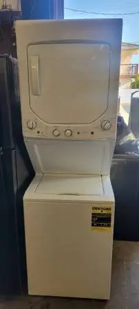 G.E 24 INCHES WIDE COMPACT ELECTRIC 1 PEICE STACKED WASHER N DRYER SET