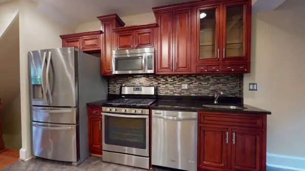 Spacious 4 BR Home with SS appliances, hardwood floors, and more!