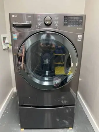 LG Washer and Dryer combo with storage pedestal