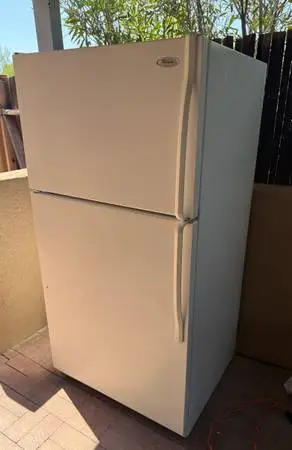 Whirlpool white refrigerator  about  20 cubic feet