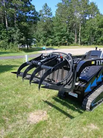 new mini skid steer grapple