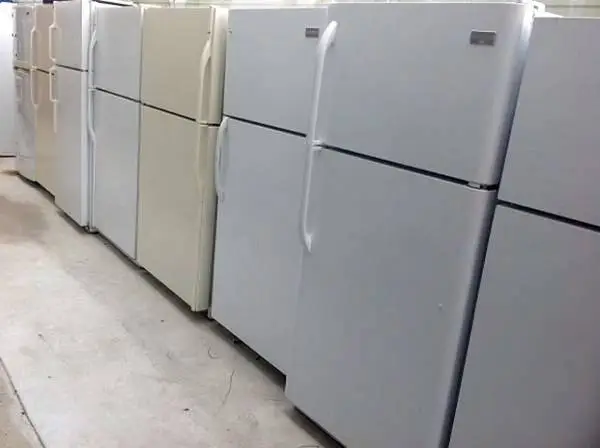 Top freezer style refrigerator