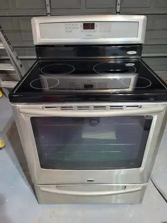 Electric range with induction cooktop