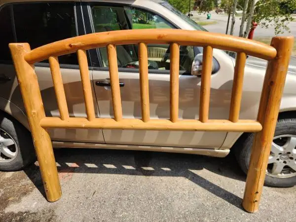 Log headboard will work as a King or Queen bed