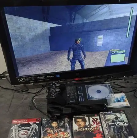 PlayStation 2 with Remote, Games and Controller