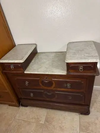 Antique dresser with granite tops and mirror