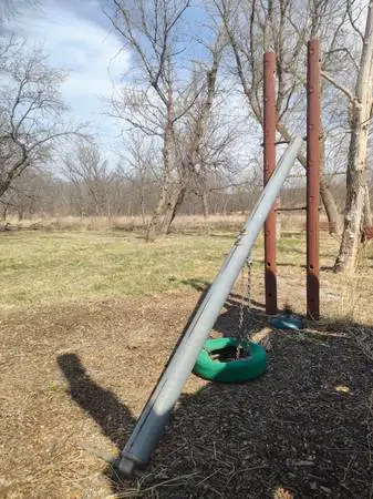 Tire swing and teeter totter for your playground. Commercial grade