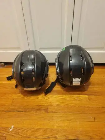Two kids hockey helmets