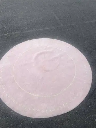 Light pink and ivory wool 7 foot area rug