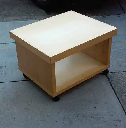 Blonde fake wood TV table with wheels