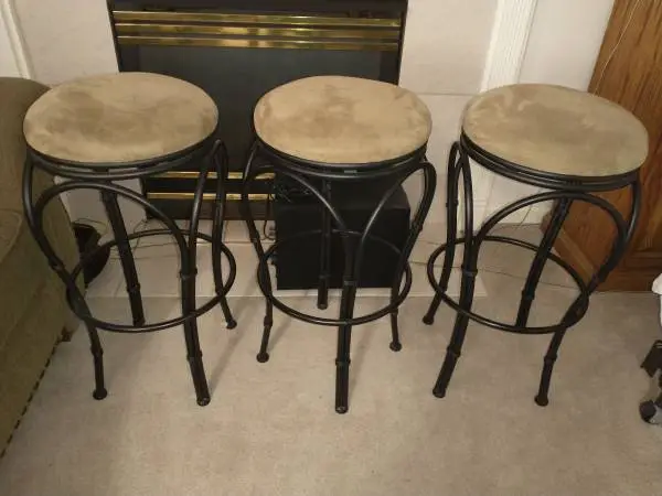Three cushioned bar stools