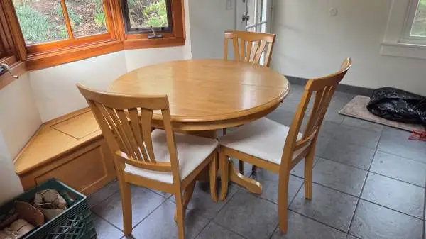 Very, very nice dining table with three chairs