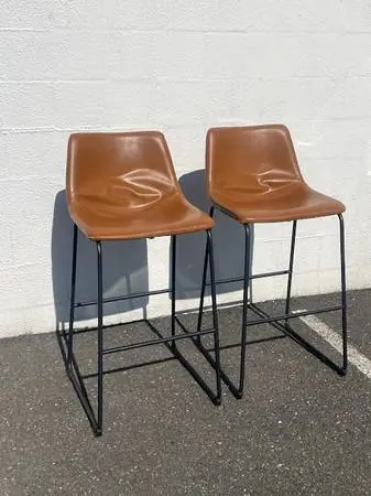 Pair of Modern faux caramel faux leather and metal barstools