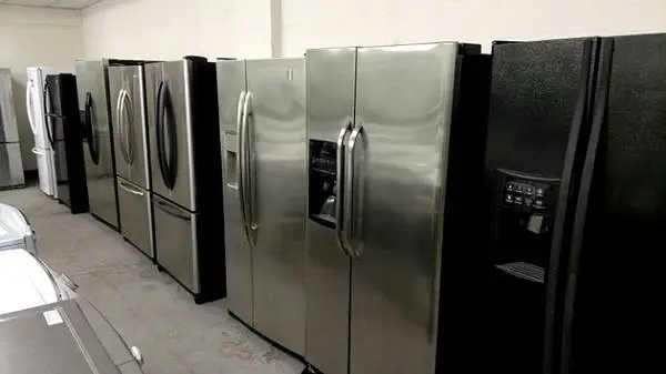 Side by side black and stainless steel refrigerator Units