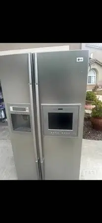 Working LG refrigerator with TV on the front will deliver and install