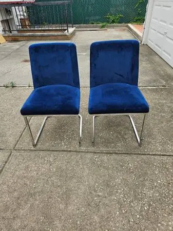 2 blue velvet chairs