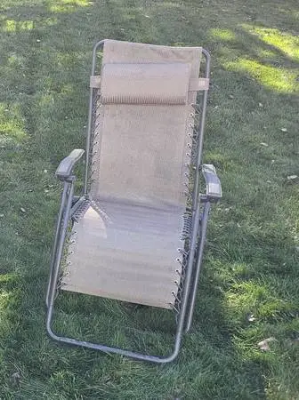 Zero Gravity Folding Tan Chair Folds up, nice relaxing chair