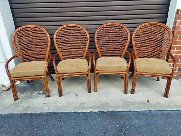 Set of Four Rattan Armchairs with Cushions.