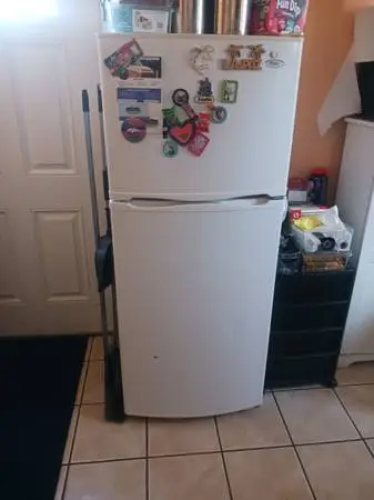 refrigerator.love seat couch .2 peace drawers.and 50 inch smart TV.