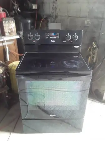 Black whirlpool glasstop stove selfcleaning. Great working condition.