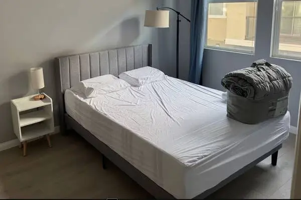 Nearly new Queen sized bed memory foam mattress + upholstered frame