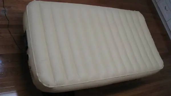 Twin size air bed with built-in pump on frame