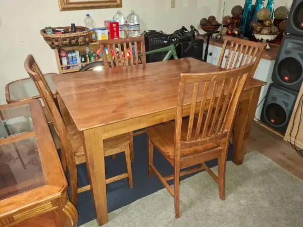 Real wood dining room table with four wood chairs