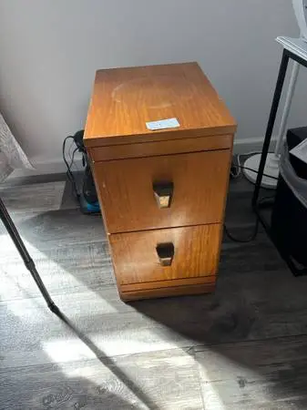 $10 file cabinet 23 x 12 1/2 x 18 circle from planter on top