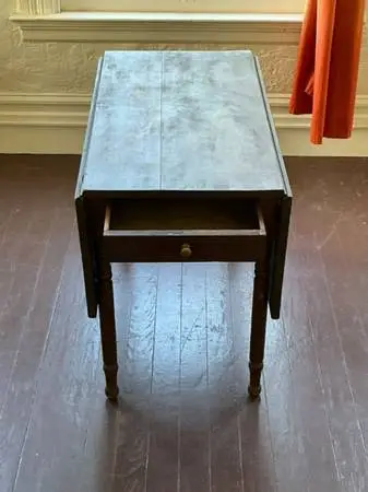 Antique walnut drop-leaf table with drawer