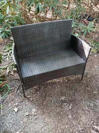Wicker chairs and a small wicker coffee table.