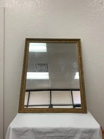 LARGE WALL MIRROR IN ORNATE MOLDED GOLD TONE FRAME
