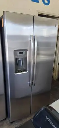 G.E 25 CU.FT STAINLESS SIDE BY SIDE REFRIGERATOR WARRANTY N DELIVERY