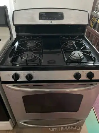 #### GE STAINLESS  BLACK STOVE WITH SELF CLEANING ##