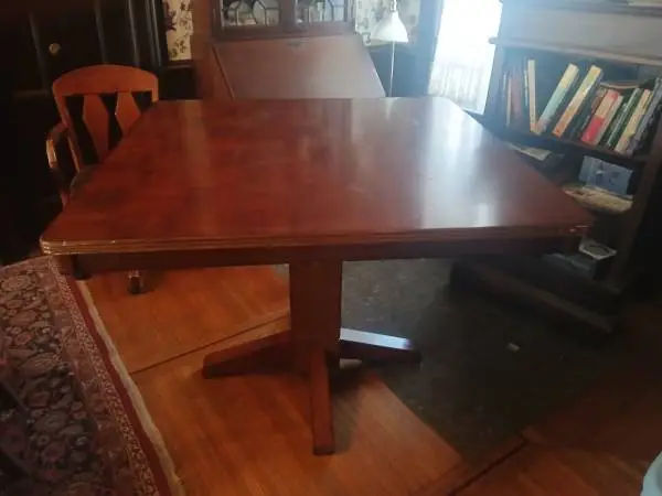 Square pedestal dining table