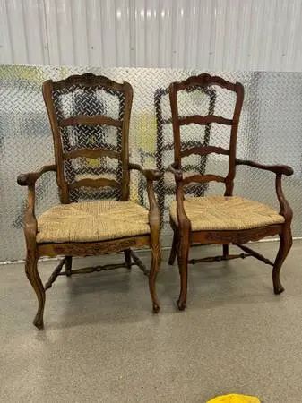 Pair of vintage country French walnut rush bottom arm chairs