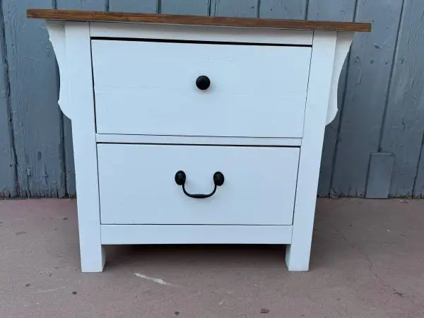 One white night stand in very good condition with two drawers