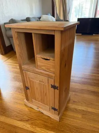 Rustic solid wood accent cabinet in a warm natural finish.