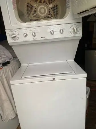 Stacked washer gas dryer
