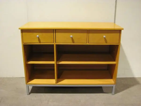Cherry laminate cabinet with three drawers and two shelves below