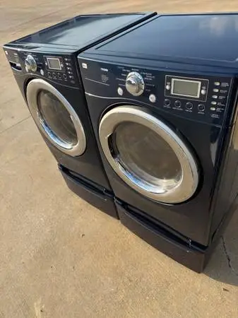 Blue color front load lg washer and lg dryer with pedestals