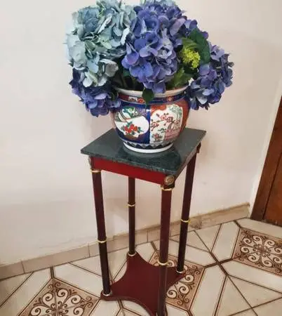 Chinese vase, flowers , table, and bowl