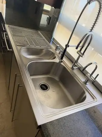 60 Kohler Professional stainless sink with drainboard + 2 faucets