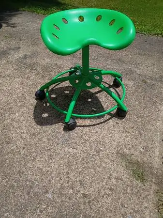 Green swivel stool with tractor seat